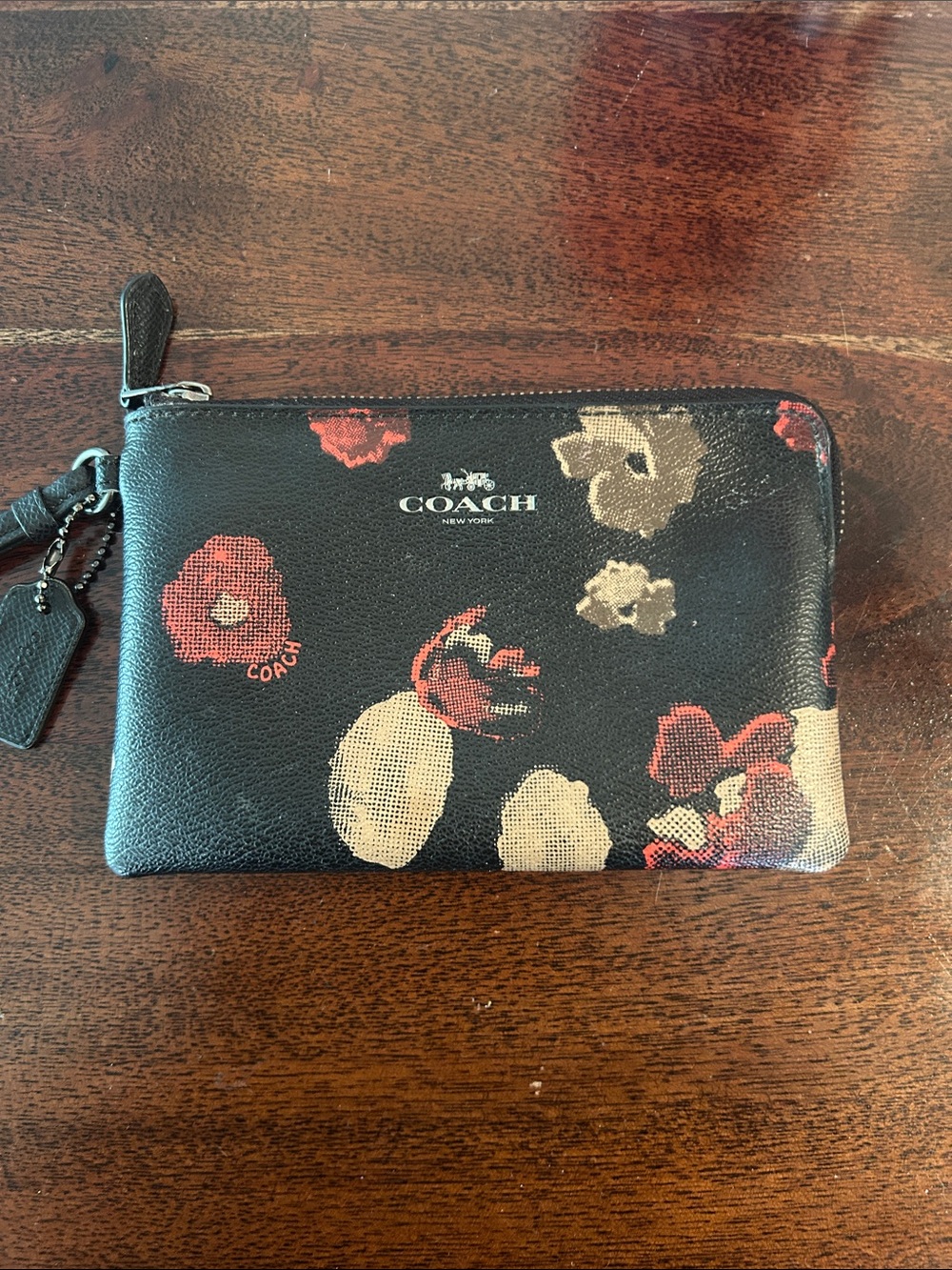 COACH Black Floral Zip Wristlet with Red and Cream Accents
